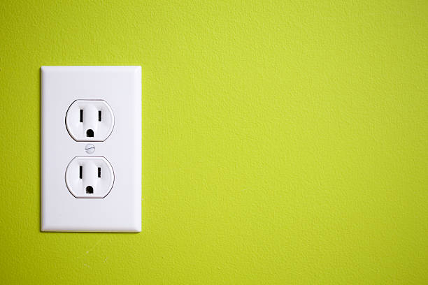 Green power outlet stock photo