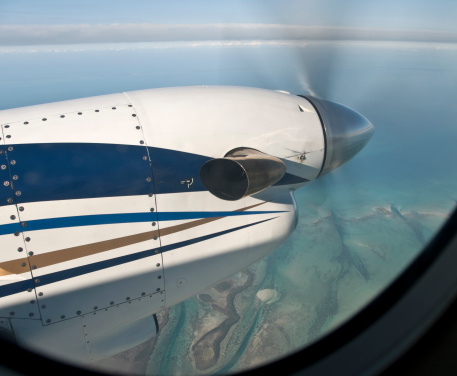 Prop on a 16 seat twin engine jet flying over Bahamas