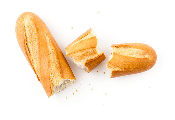 White baguette pieces on a white background stock photo