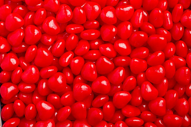 istock Valentine’s Day Red Hot Candy Hearts Close-Up & Full Frame 182484169