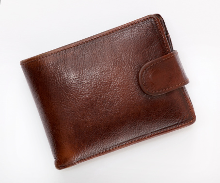 Photo of a brown leather wallet on a white background