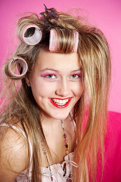 istock Young woman with curlers 182486157