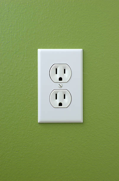 istock Power Outlet on Green Wall 182486214