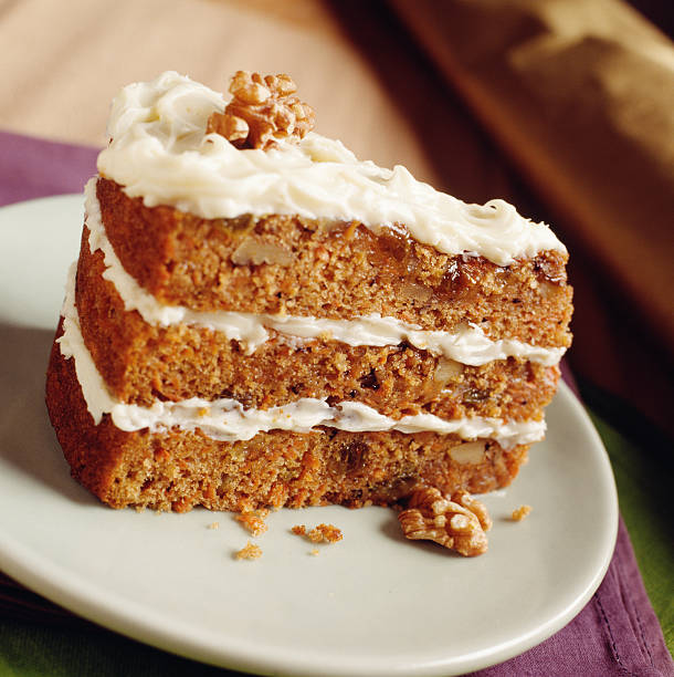 Walnut Carrot Cake Close-up of Walnut Carrot Cake. carrot cake stock pictures, royalty-free photos & images