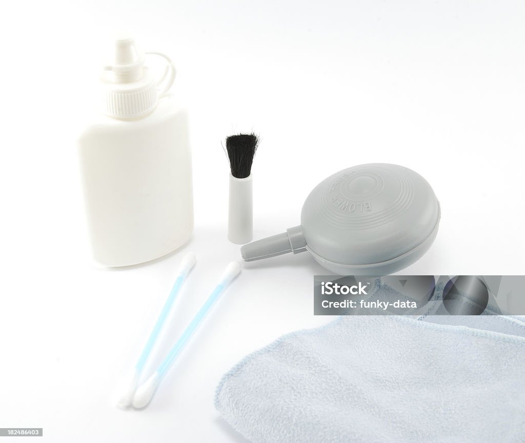 Lens cleaning kit "A lens cleaning kit, consisting of a cleaning solution, blower-brush, Q-tips and cloth. Isolated on white." Blue Stock Photo
