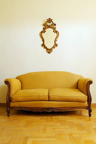 istock Vintage Yellow Sofa and Gold Mirror 182487138