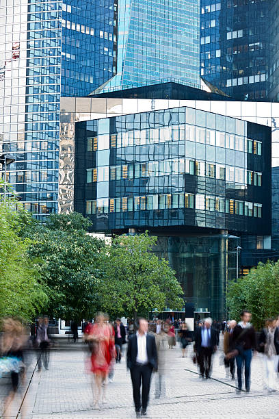 istock Blurred Business People Walking Outside Office Tower 182487840