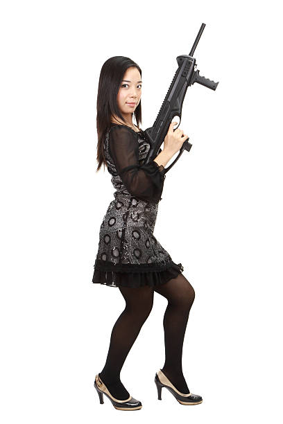 istock Beauty in profile, armed with gun, looking at you (series) 182488494