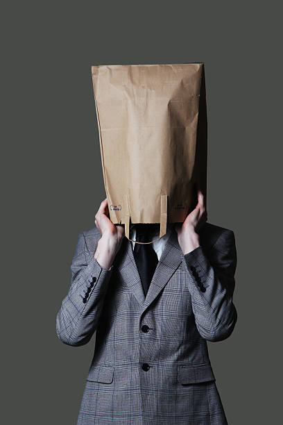 istock Businessman with a brown paper bag on his head 182488590