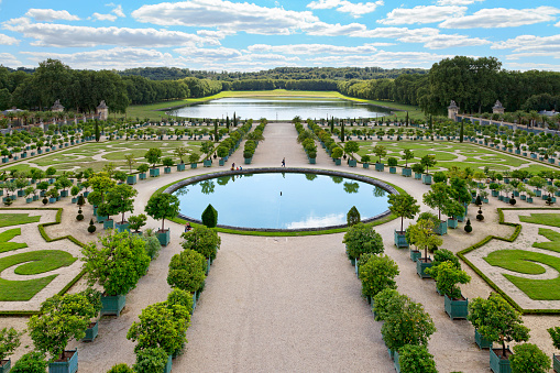 Versailles, France - August 20 2017: Orangery garden in the park of Versailles, with orange trees in boxes.