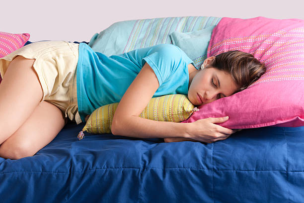 istock Cute young woman taking a nap 182489832