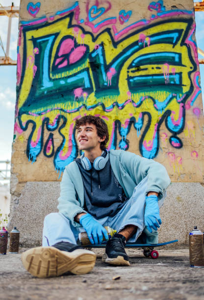 istock Male graffiti artist with spray cans 1824906069