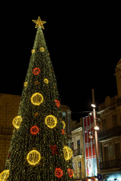 istock Festive architecture with illuminated Christmas tree and decoration. Badalona, Spain 1824906604
