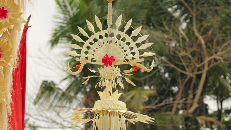 Close-up of grand handmade decoration crafted from leaves, camera panning up