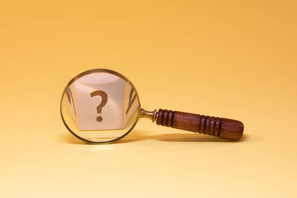 istock Magnifying glass with question mark on yellow background. 1824908847