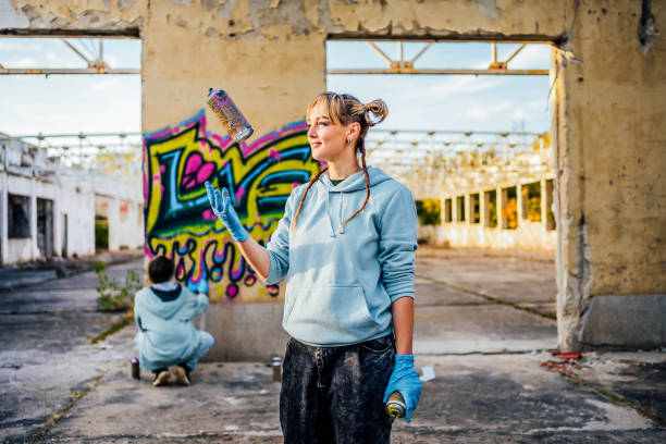 istock Female graffiti artist with spray can 1824909222
