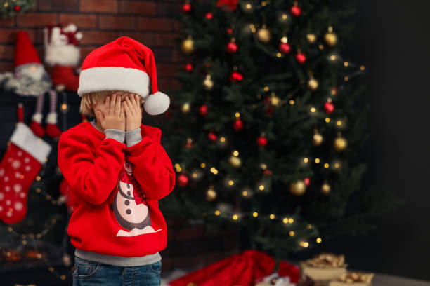 istock Little child closing his eyes with hands at home, space for text. Christmas celebration 1824909453