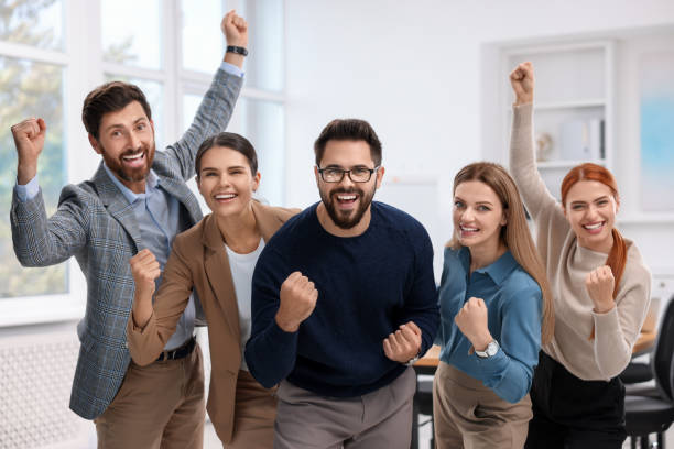 istock Team of employees celebrating success in office 1824910551