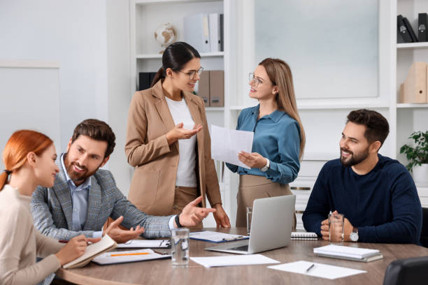 istock Team of employees working together in office 1824912232