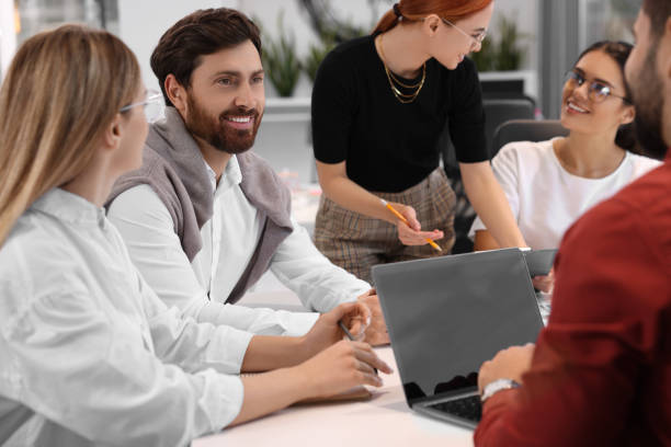 istock Team of employees working together in office 1824913285