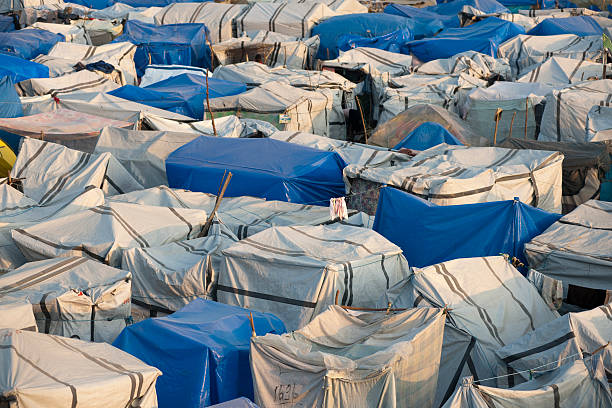 Tents of an IDP camp "Tents of a IDP camp after the earthquake in Haiti.See other photos of Haiti, taken february 2010:" refugee camp stock pictures, royalty-free photos & images