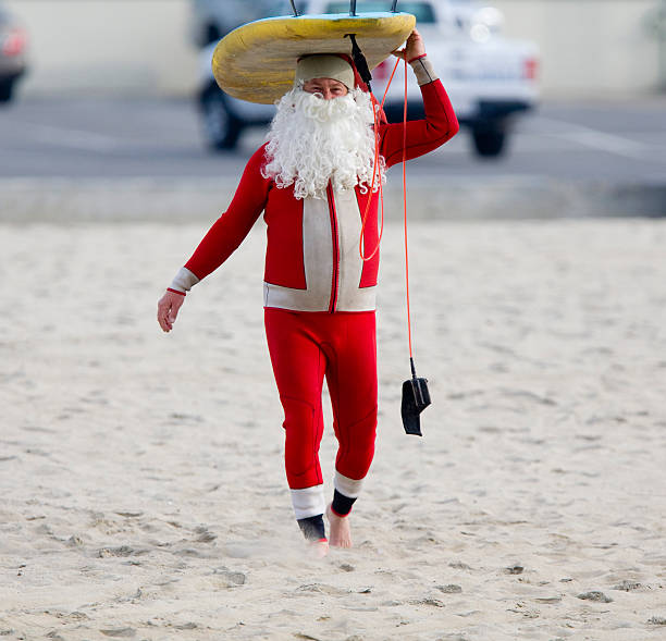 Santa Clause getting ready to Surf stock photo