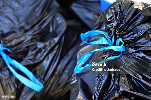 Black Garbage Bags Tied With Blue Strings Stock Photo - Download Image Now - Garbage Bag, Garbage, Black Color