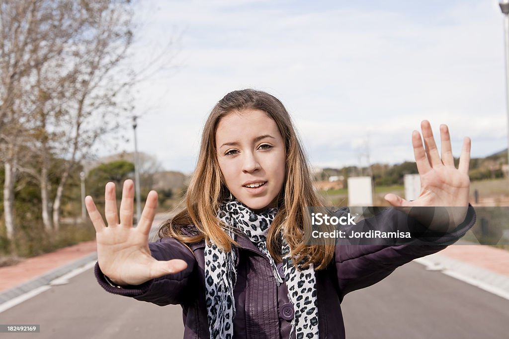 Stop Young woman making a stop gestureMore like this:iStockphoto.com: Lightbox 14-15 Years Stock Photo