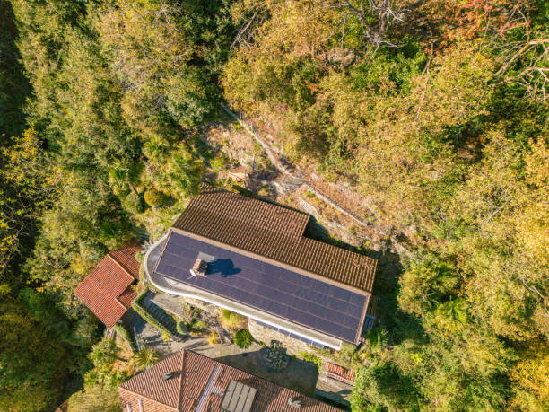 istock Drone shot of home powered by solar panels 1824925275
