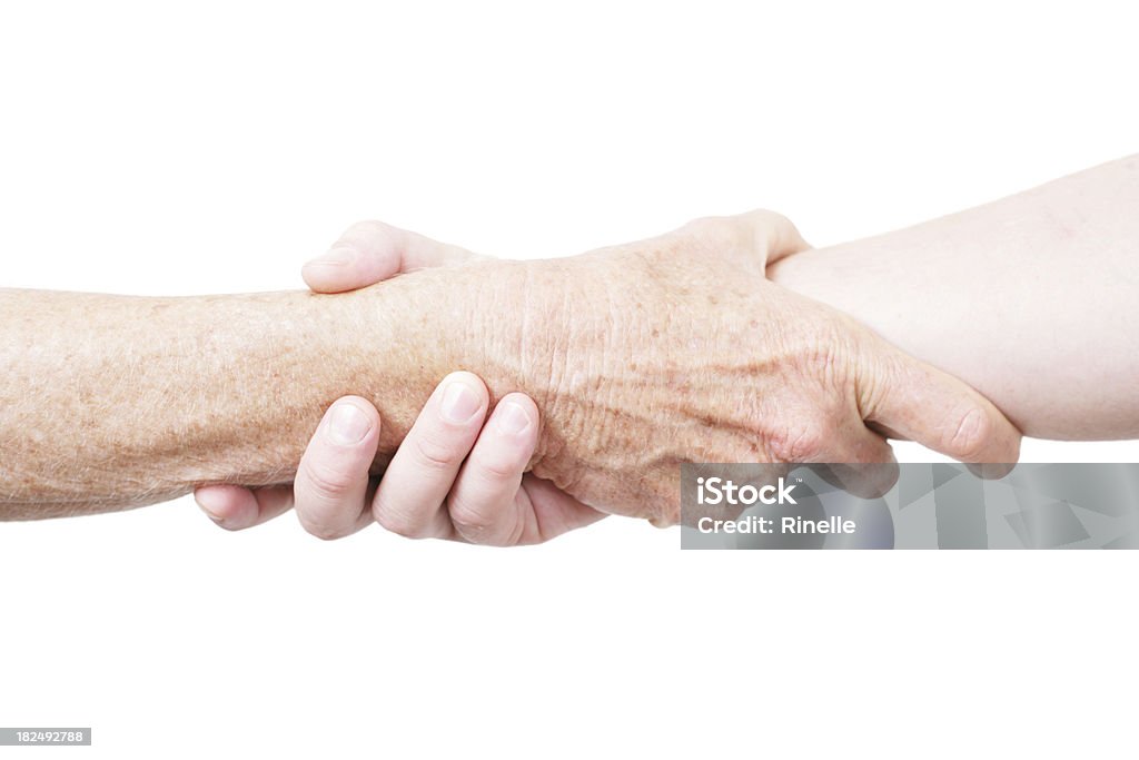 I won't let go "A young adult and an elderly person clasping hands together, isolated on white." Greeting Stock Photo