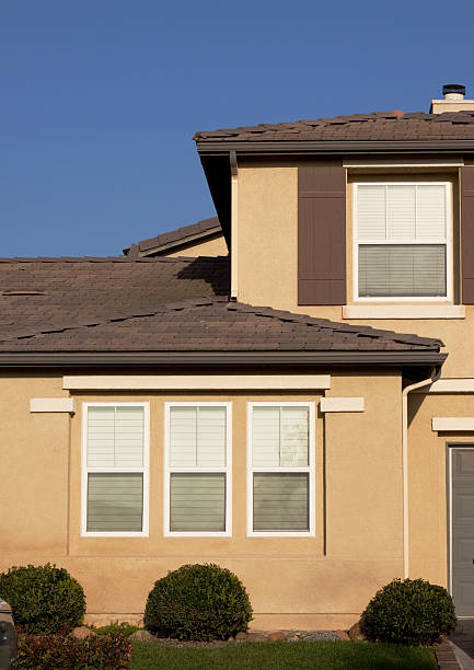 istock Stucco Home Exterior and Blue Sky 182493009