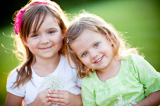 istock Happy Sisters Smiling Together Outside 182493309