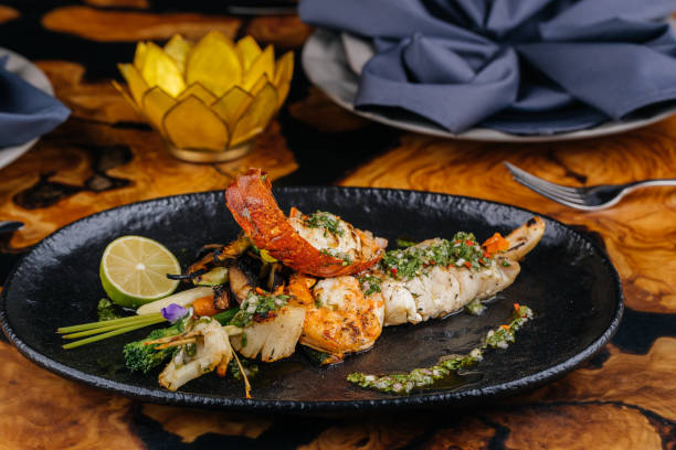 istock Seafood Mixed Grilled with prawn, shrimp, squid and crab served in dish isolated on table side view of Seafood Main Course arabic food 1824939536