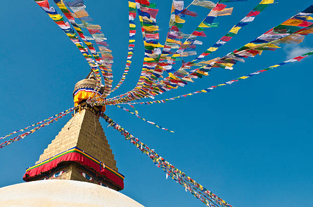 istock Buddhist prayer flags golden stupa white mandala temple Kathmandu Nepal 182494430