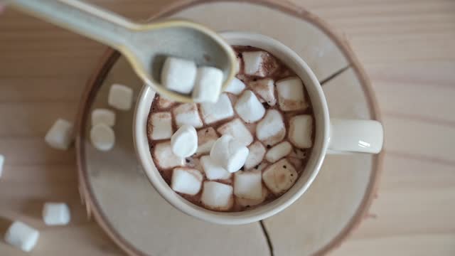 Adding marshmallows on chocolate
