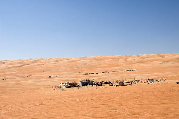 istock nomadic settlement in wahibah sands 182495076