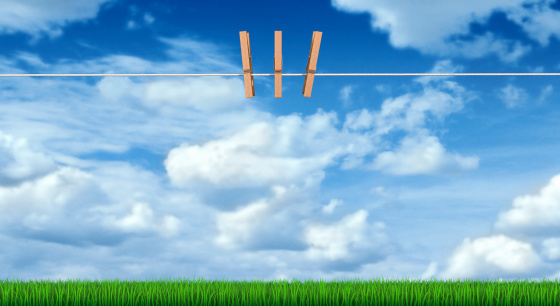 Clothesline on clouds background.