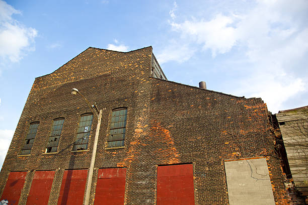 Worn Out Warehouse and Factory in Detroit Old Warehouse/factory in run down section of Detroit detroit ruins stock pictures, royalty-free photos & images