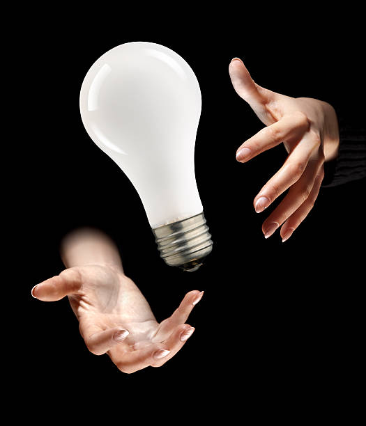 istock Incandescent Light Bulb Levitates In Magician's Hands 182496428