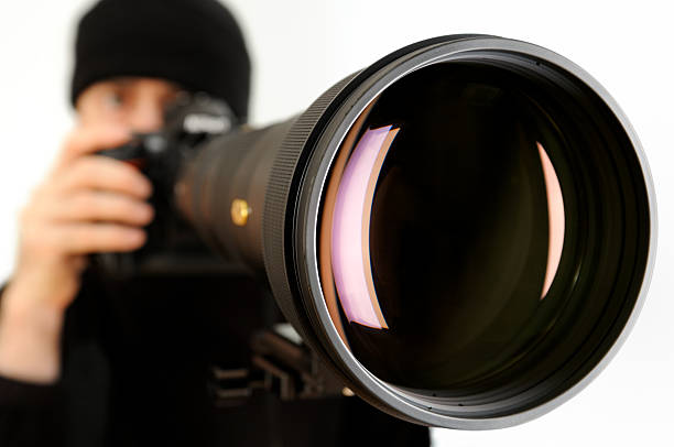 istock Man with Huge Telephoto Lens 182496682
