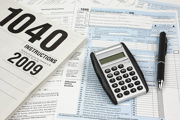 istock Tax Forms with Calculator and Pen 182496857