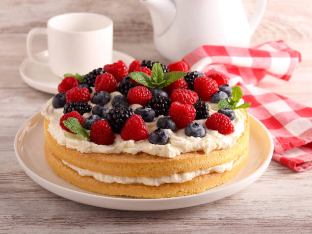 istock Cream and mixed berry sandwich cake 1824971344