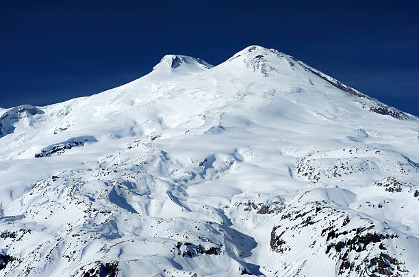 Mt. Elbrus "Mt. Elbrus's highest peak is the highest mountain in all of Europe (5,642 metres). Elbrus - symbol of the Caucasus." north caucasus photos stock pictures, royalty-free photos & images