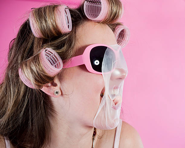 istock Young woman chewing bubble gum 182498032