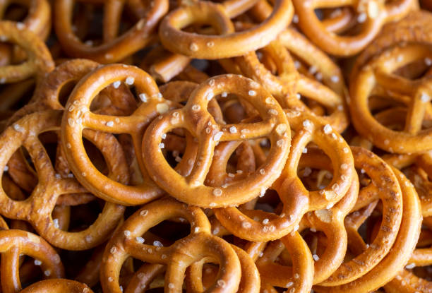 istock Mini pretzels with salt on wooden background. Selective focus. 1824984457