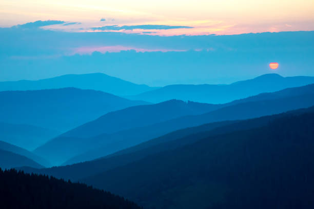 istock Morning fog in a mountain valley area 1824984980