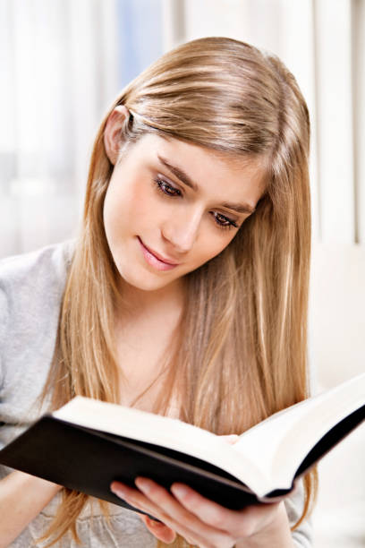 istock Teen enjoying a book 182498499
