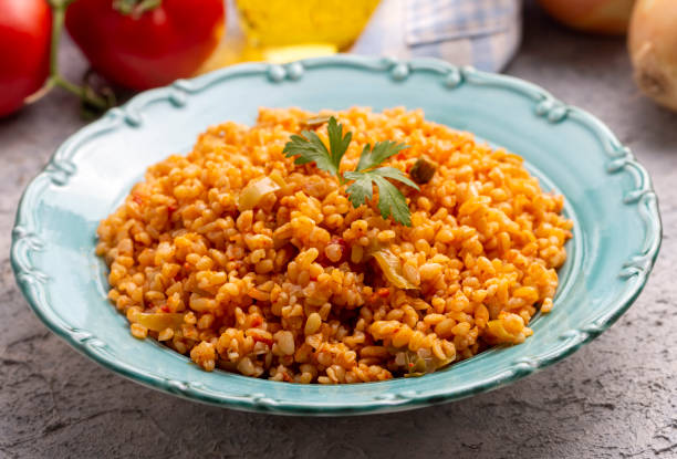 istock Traditional turkish bulgur pilaf with tomato sause in plate (Turkish name; meyhane pilavi) 1824993704