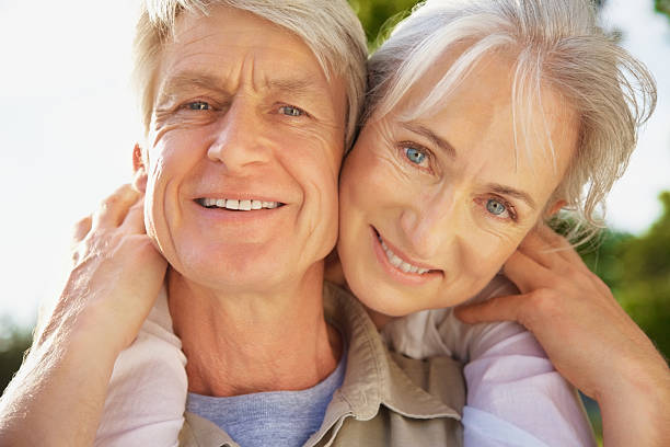 istock Senior woman hugging a man from behind 182499380