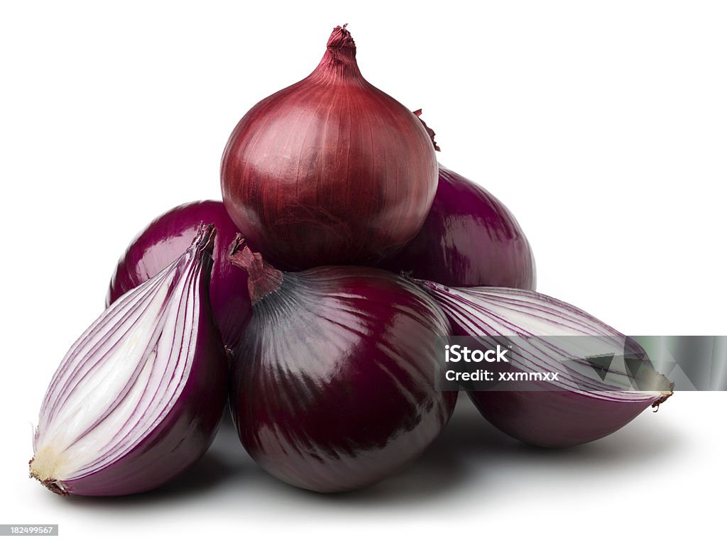 Pyramid of red onions with one cut in half Red onions on white. This file includes Clipping Path Stock Photo
